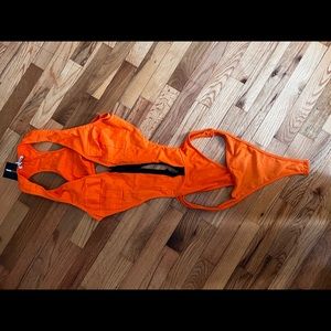 Orange body suit